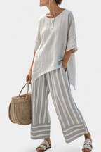 Talvora | Blusa Asimétrica Elegante y Pantalón de Rayas